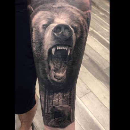 Black And Grey Grizzly Bear With Nature Scene Tattoo