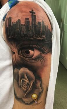 Black and Grey City Skyline & Realistic Eye Tattoo
