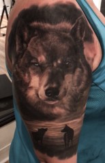 Black And Grey Wolf Scene Tattoo