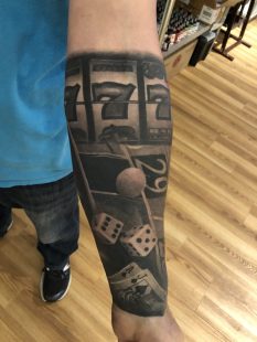 Black And Grey Gambling Sleeve Tattoo