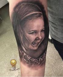 Black and Grey Photo Realistic Child Portrait Tattoo