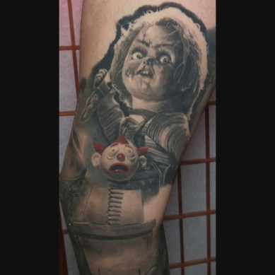 Black and Grey Chucky Realism Tattoo