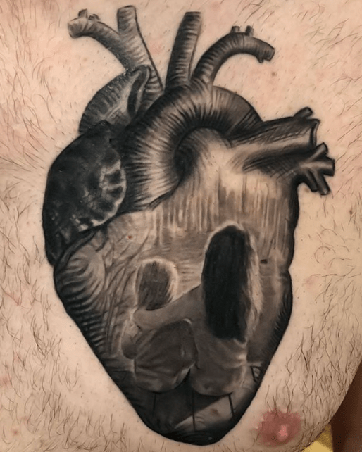Black and Grey Human Heart with Portrait Scene Tattoo