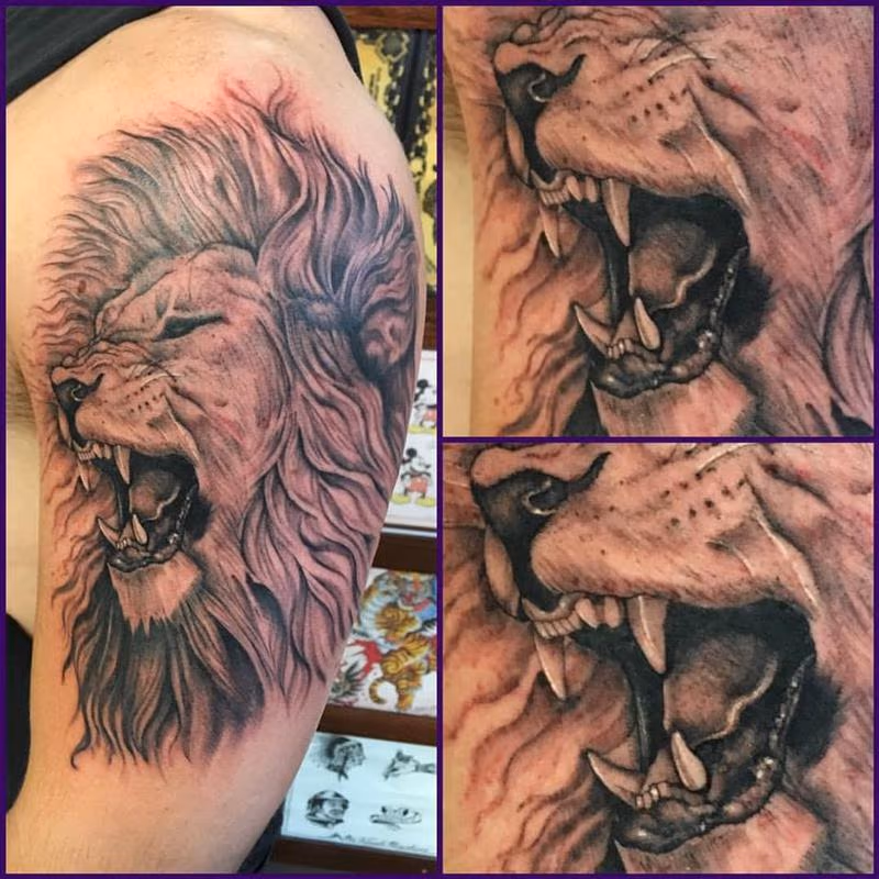 Black and Grey Lion Tattoo