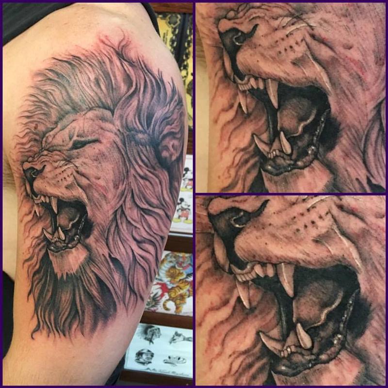 Black and Grey Lion Tattoo