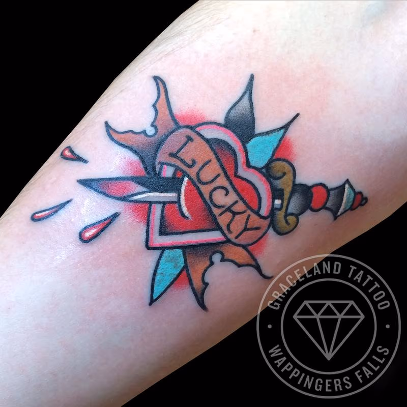Traditional Heart and Dagger Tattoo
