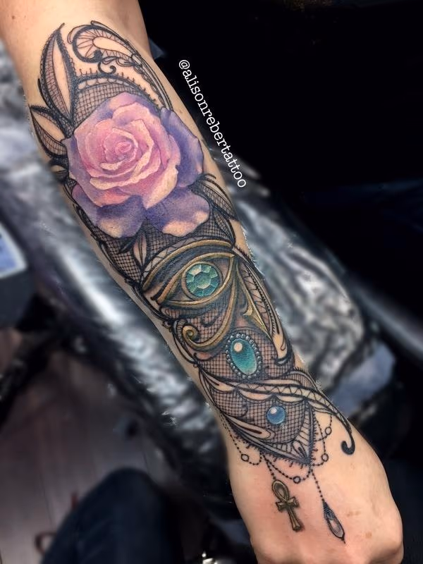 Eye of Horus and Rose forearm tattoo