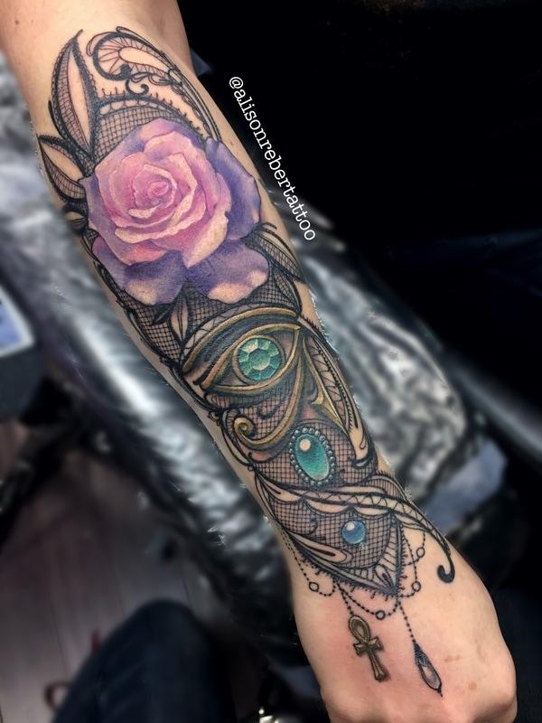 Eye of Horus and Rose forearm tattoo