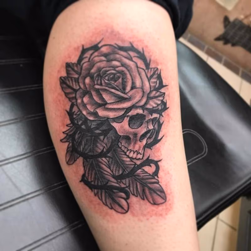 Skull/ rose/ feathers