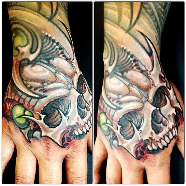 Skull hand tattoo