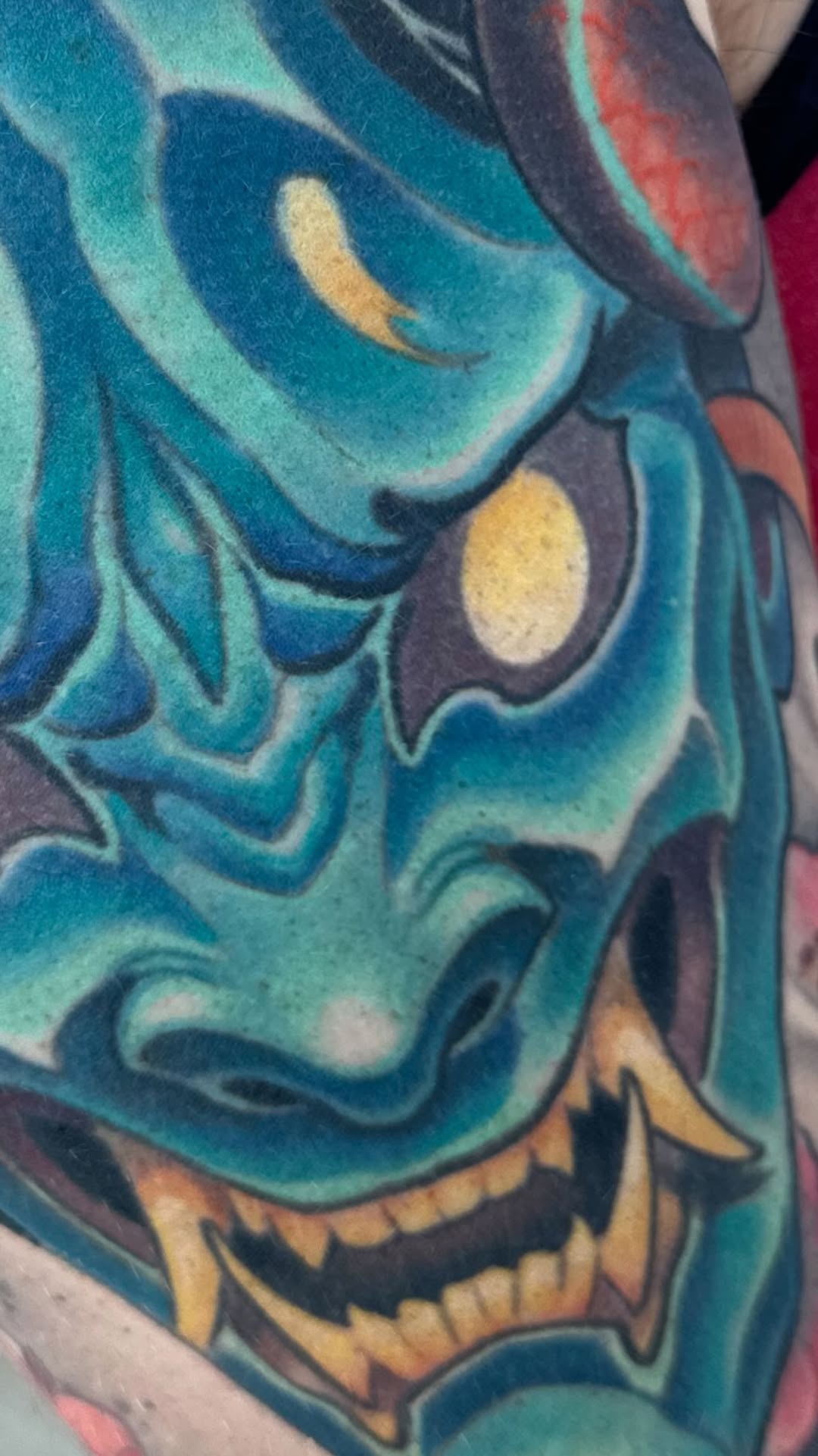Color hannya mask with waves, arm tattoo