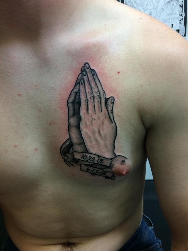 Black and grey praying hands