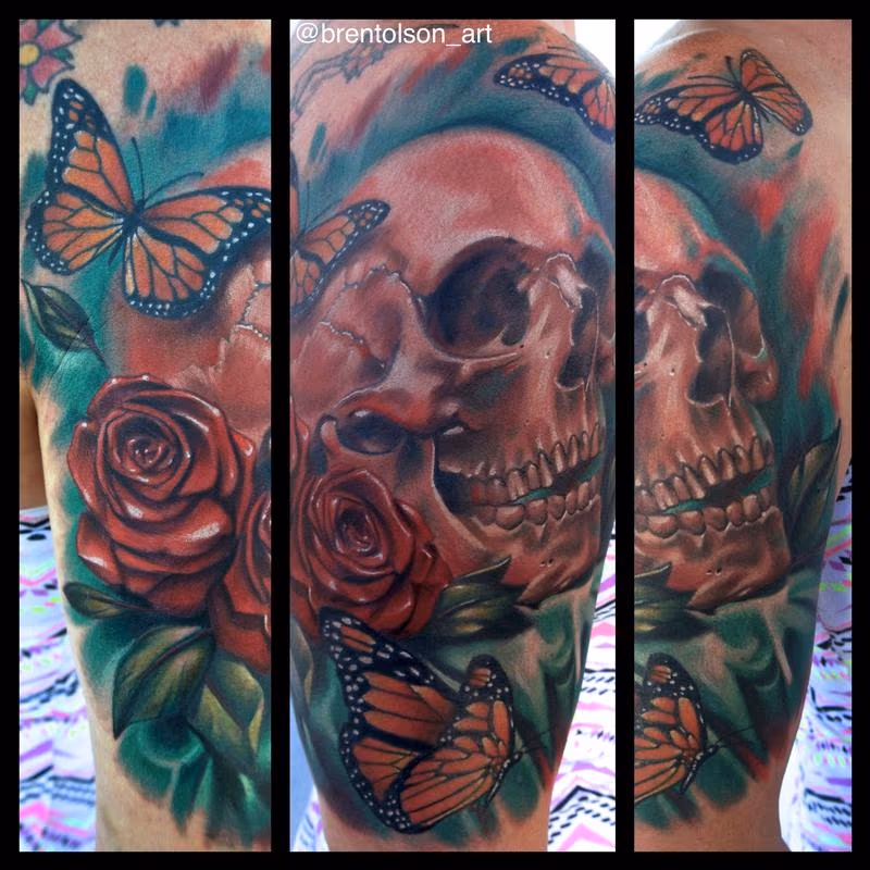 realistic color skull with roses and butter fly tattoo. Brent Olson Art Junkies Tattoo