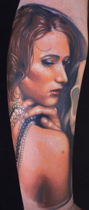 realistic color portrait of a girl tattoo. Brent Olson Art Junkies Tattoos