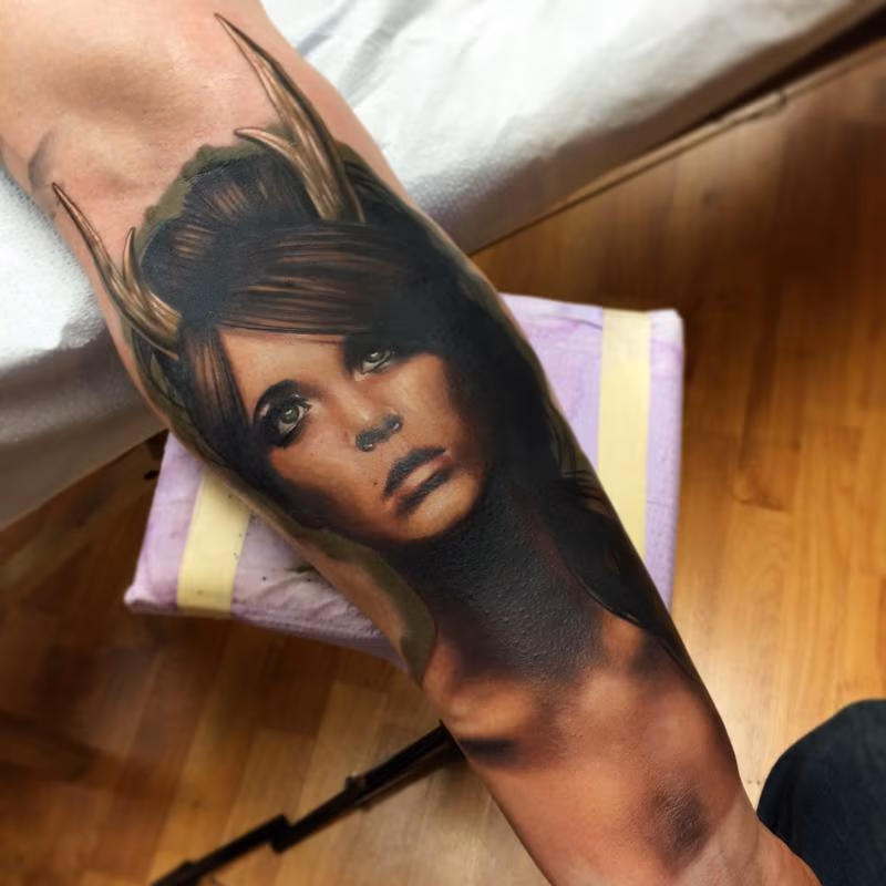 Realistic color portrait of girl with horns tattoo, Brent Olson Art Junkies Tattoo