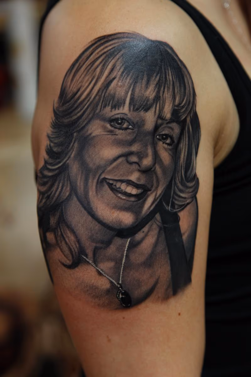 Black and Grey realistic portrait tattoo