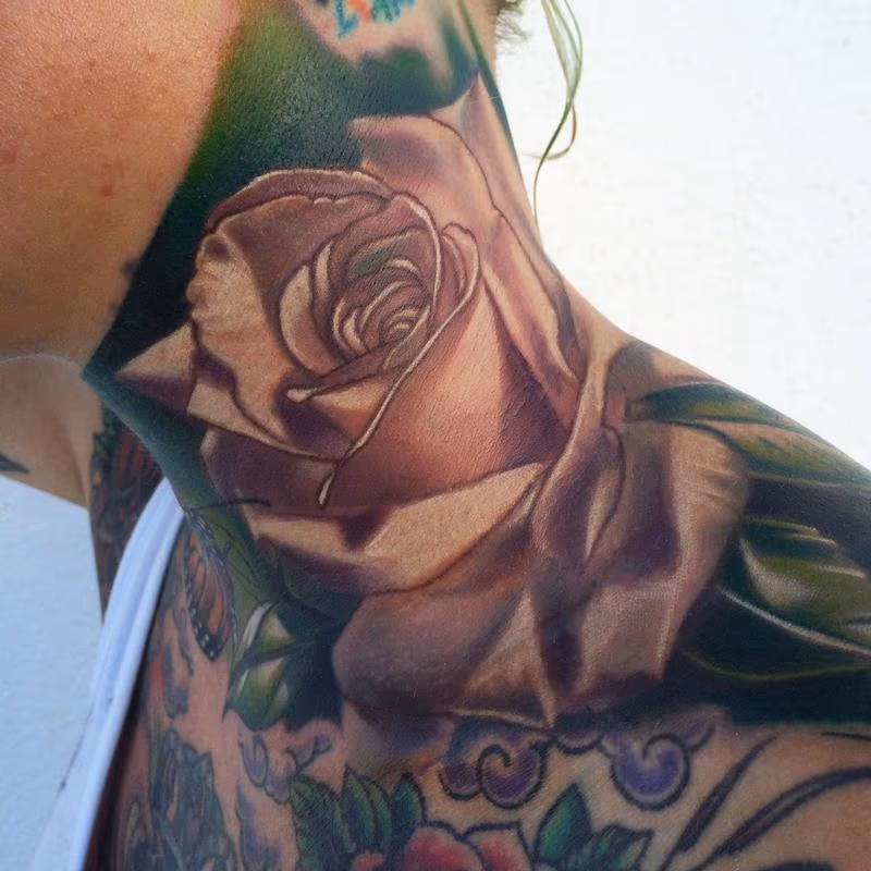 Realistic color rose tattoo, Brent Olson Art Junkies Tattoo.