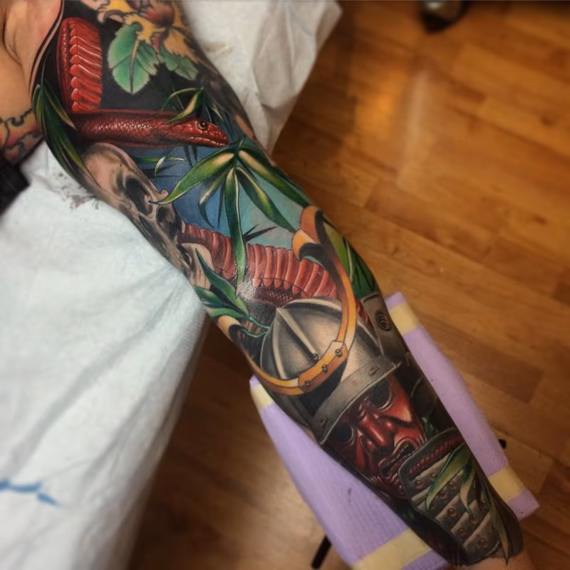 Realistic color Japanese sleeve with samurai, Geisha and snakes tattoo. Brent Olson Art Junkies Tattoo