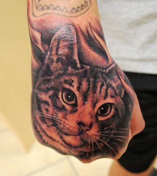 Muecke Cat Hand Tattoo