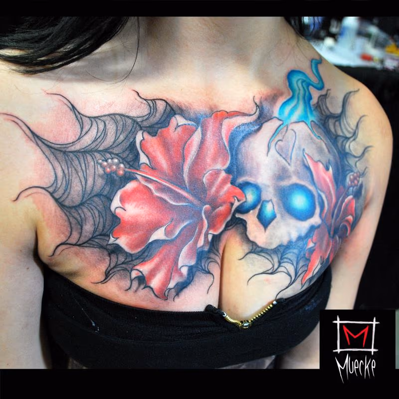 Muecke Chest piece tattoo skull spiderweb rose flowers girl ink