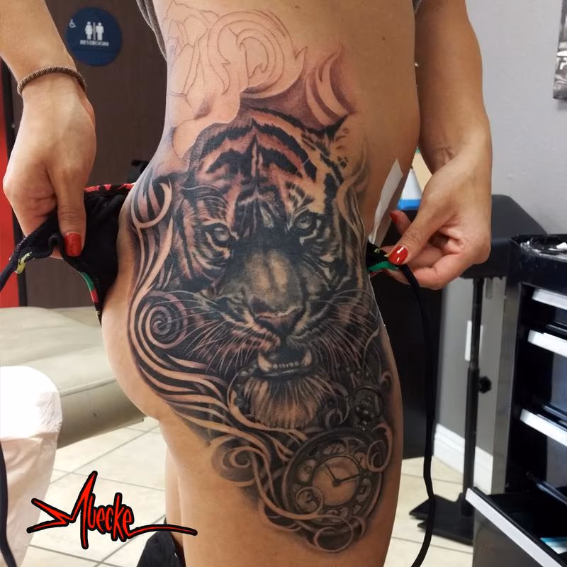 Tiger tattoo and timepiece