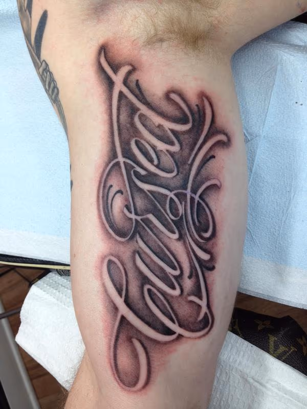 "Cursed" Script Tattoo