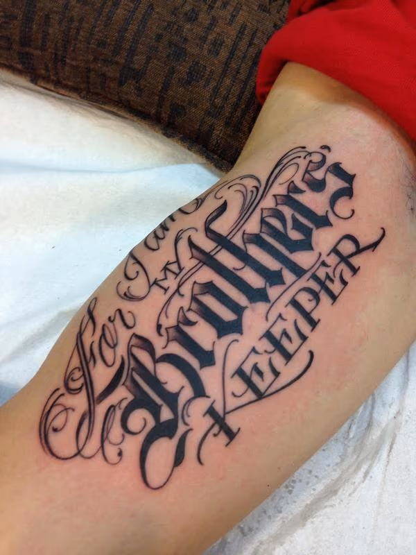 "For I Am My Brother's Keeper" Script Tattoo