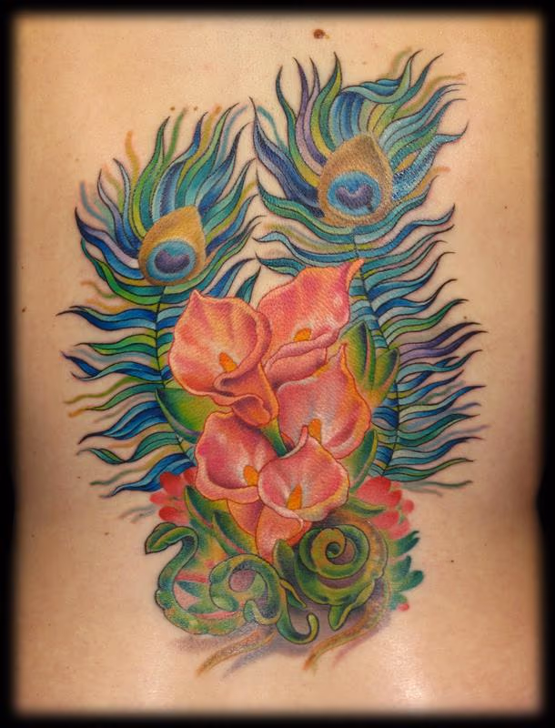 peacock feathers and calla lilies