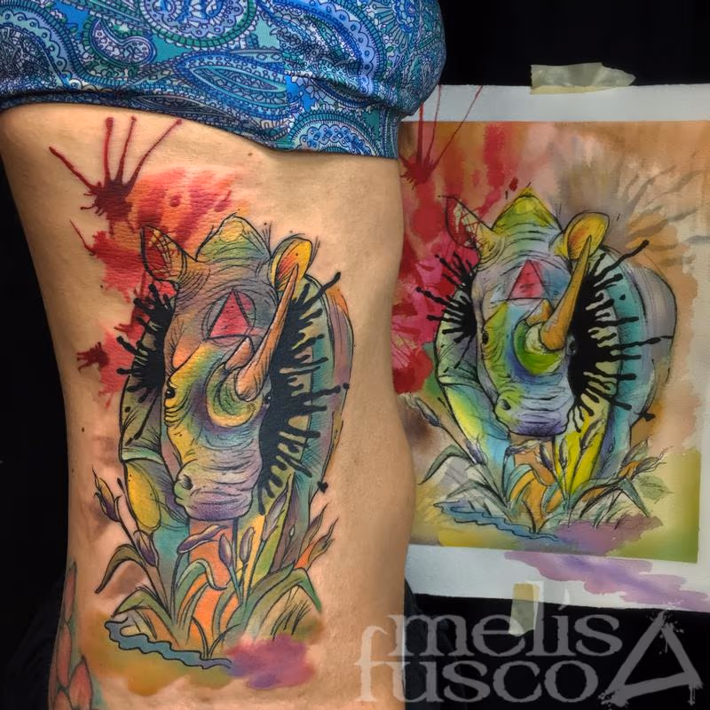 Rhino tattoo next to painting