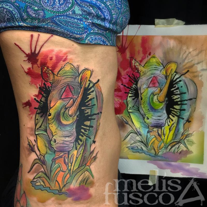 Rhino tattoo next to painting