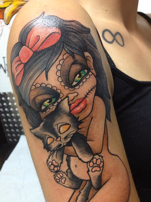 santa muerte doll with her lilblack cat
