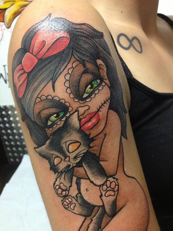 santa muerte doll with her lilblack cat