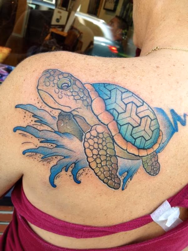 Sea turtle surfing on a wave