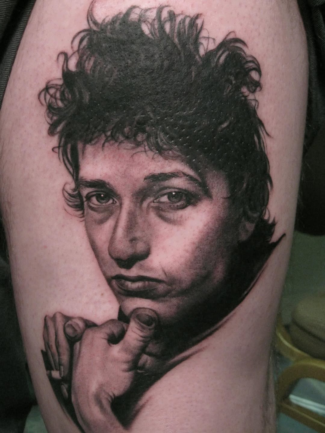 Bob Dylan portrait tattoo, black-and-grey realism