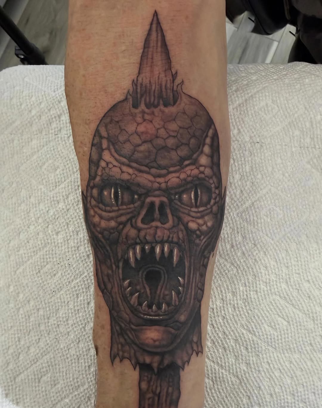 Demon skull tattoo, forearm