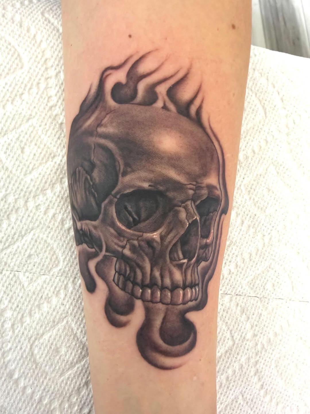 Flaming skull with realism shading, forearm