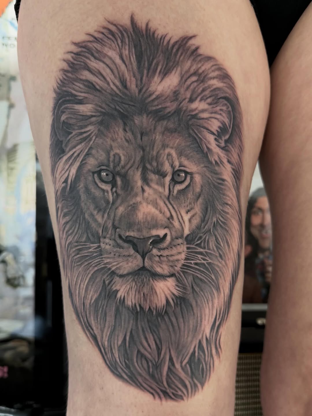 Black-and-grey lion portrait, thigh