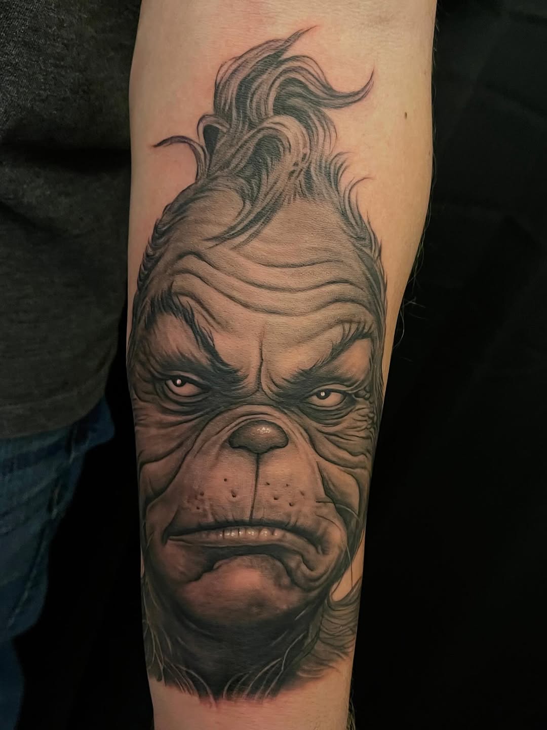 Grinch portrait tattoo, forearm