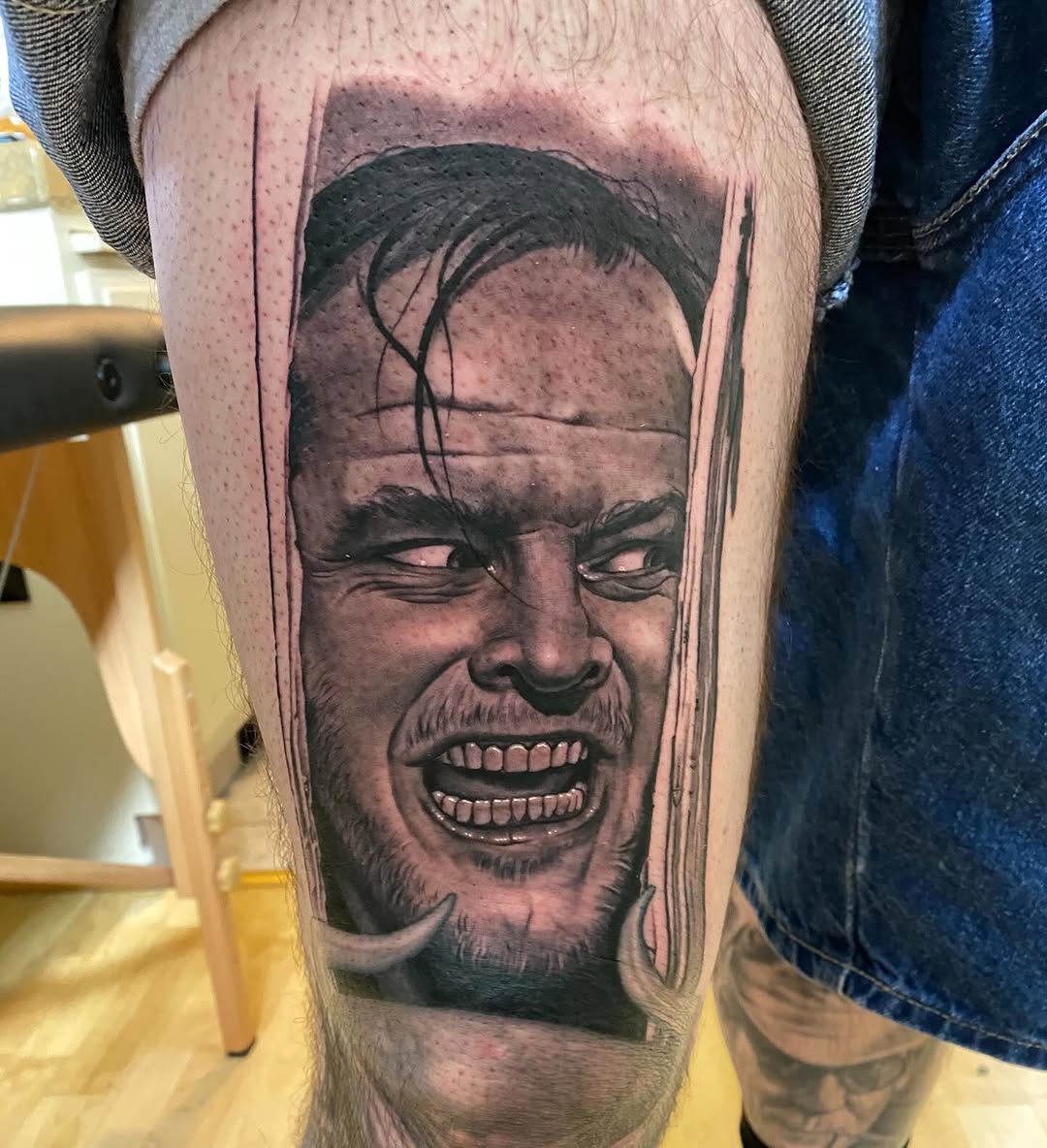 Jack Nicholson portrait tattoo, thigh