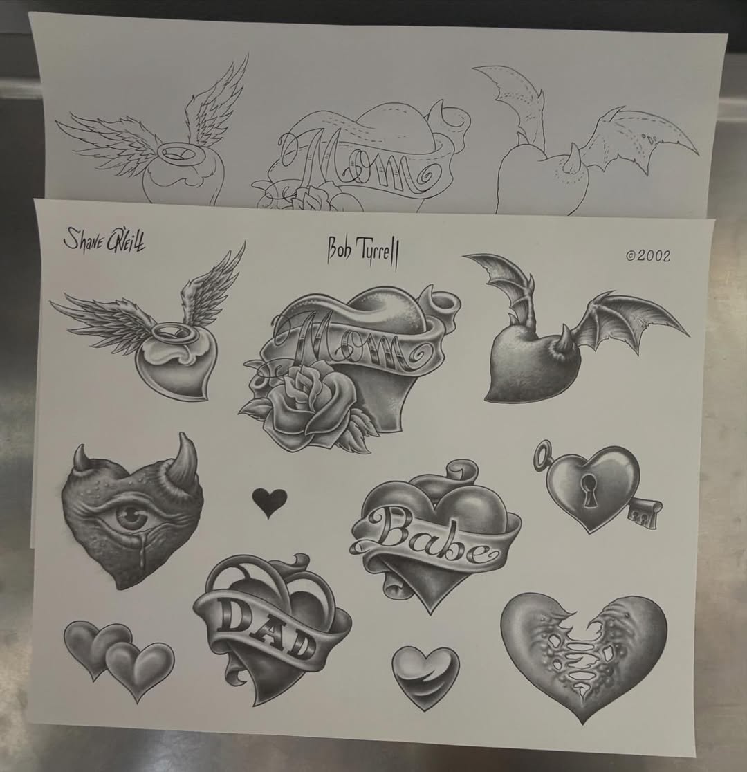 Traditional flash sheet with hearts, daggers, and winged designs