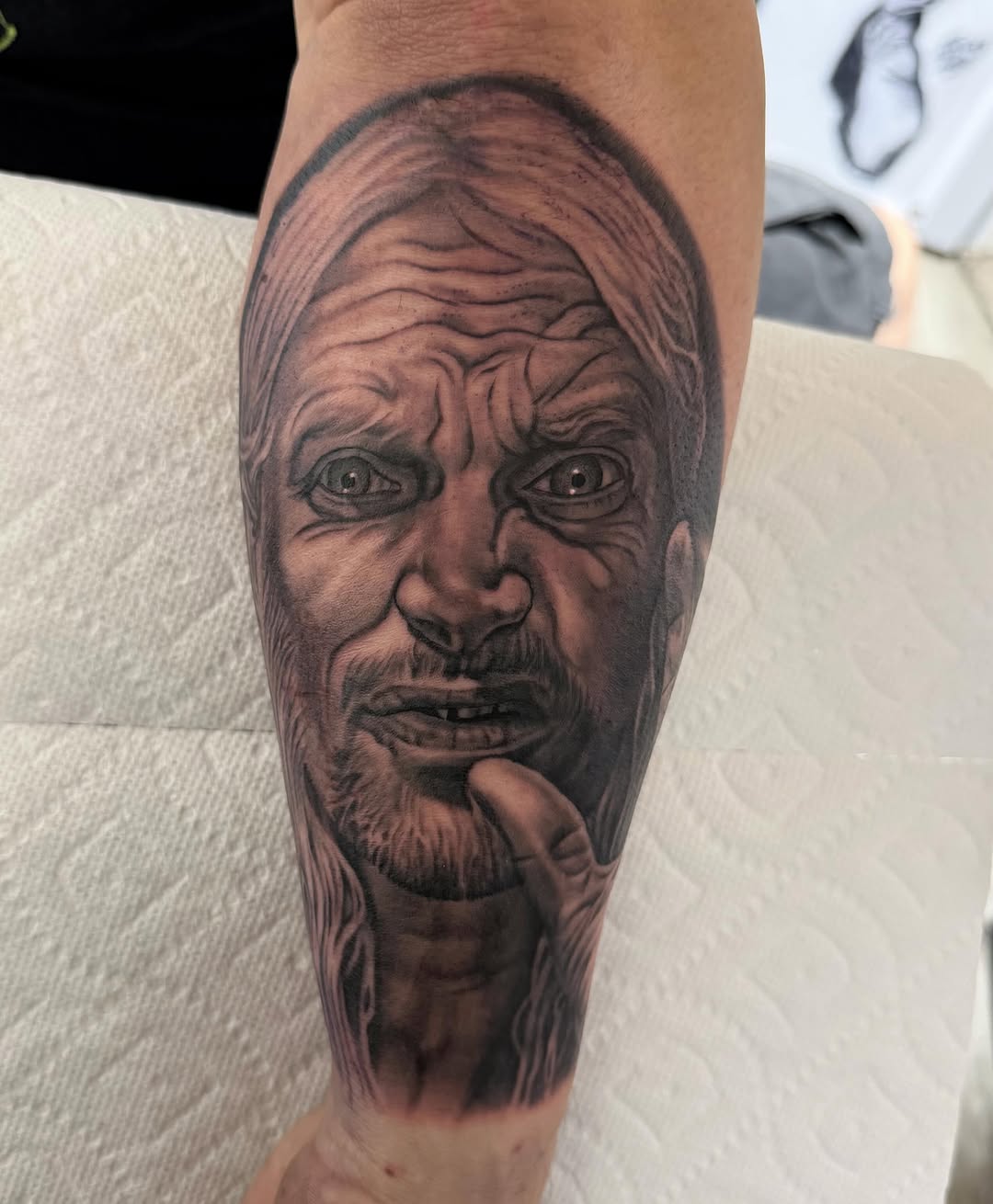 Bill Moseley portrait tattoo on calf, black-and-grey