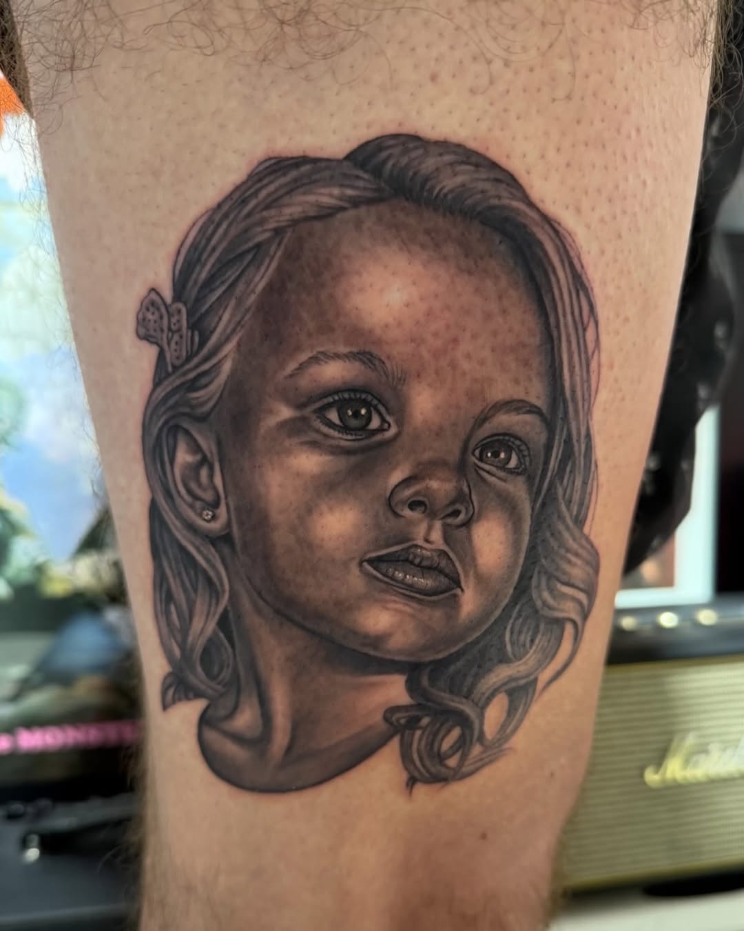 Black-and-grey portrait of young girl, thigh