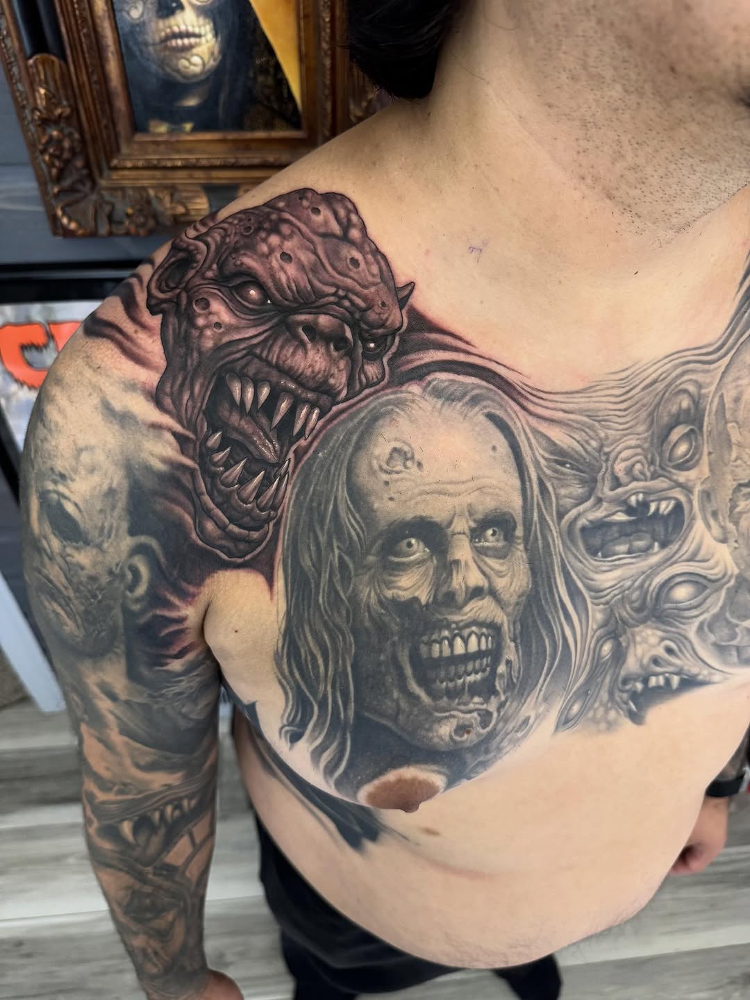 Monster chest tattoo in black-and-grey