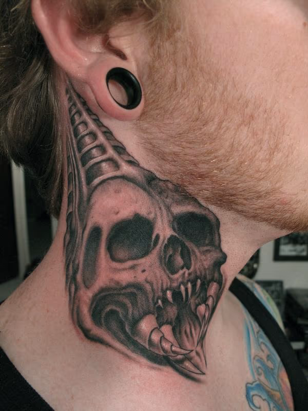 Skull on neck tattoo