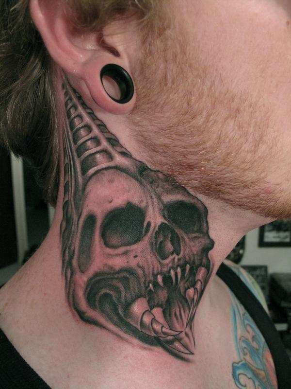 Skull on neck tattoo