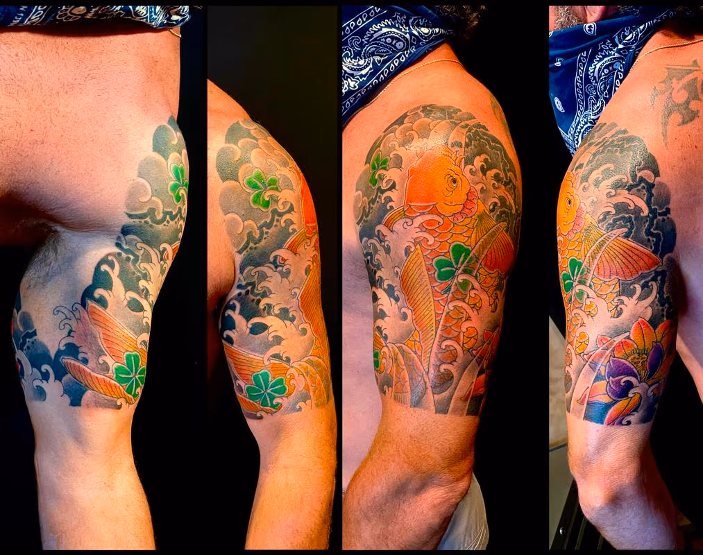 Koi and lotus half sleeve tattoo