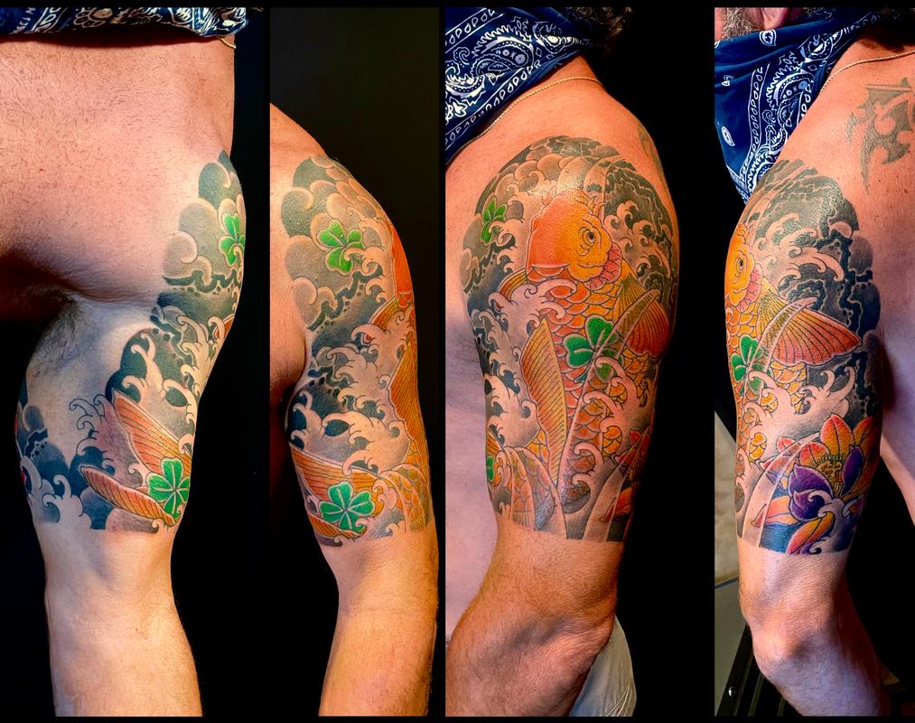 Koi and lotus half sleeve tattoo