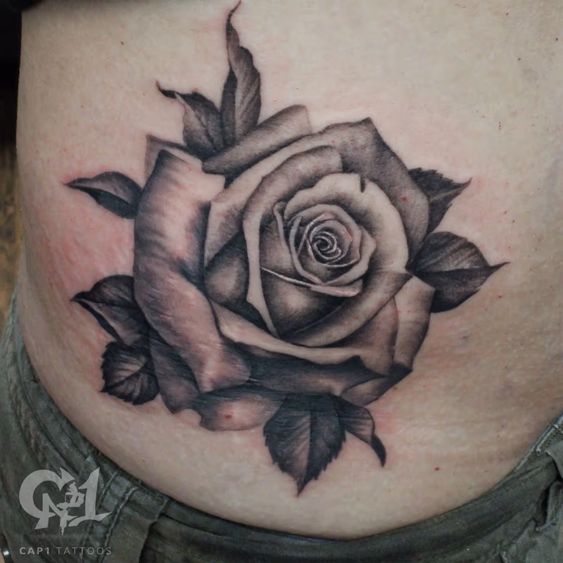 Black And Grey Rib Cage Rose Tattoo
