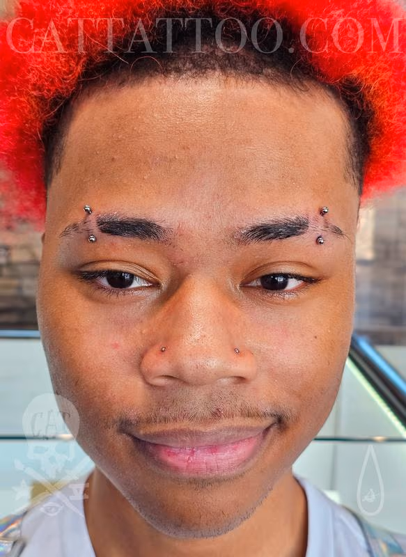 Double Eyebrow Piercing