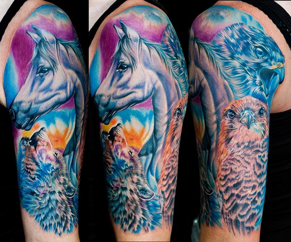 this tattoo has a portrait of her horse which represents her heart falcons for her freedom and a wolf for her sprit she let me have total control of design and color really fun piece done with stigma hyper and fusion ink